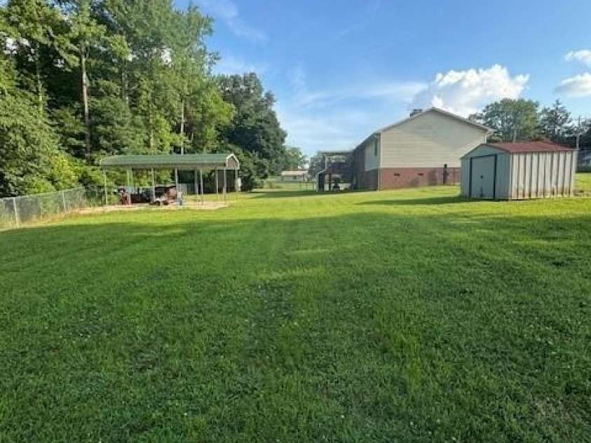 3085 Faith Road, Salisbury, NC 28146.  MLS# CAR4276895, YatesRealty ID 24115. Lower side yard