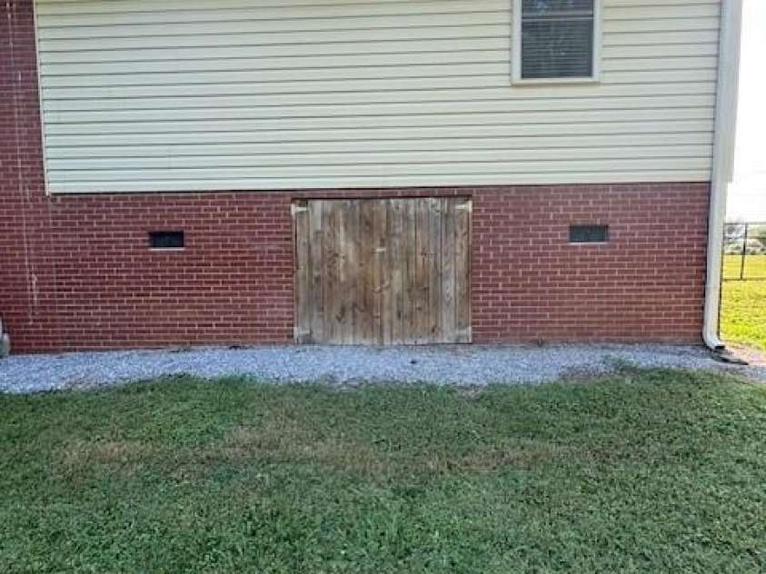 3085 Faith Road, Salisbury, NC 28146.  MLS# CAR4276895, YatesRealty ID 24115. Tall crawlspace door