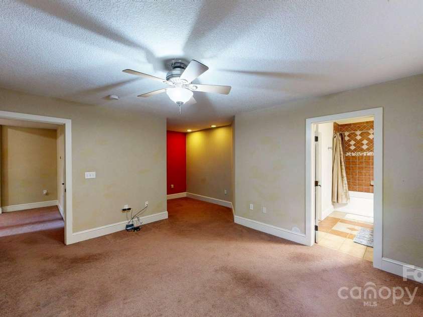 6 Sunrise Valley, Leicester, NC 28748.  MLS# CAR4283211, YatesRealty ID 2412. Basement Bedroom with full bath and office niche