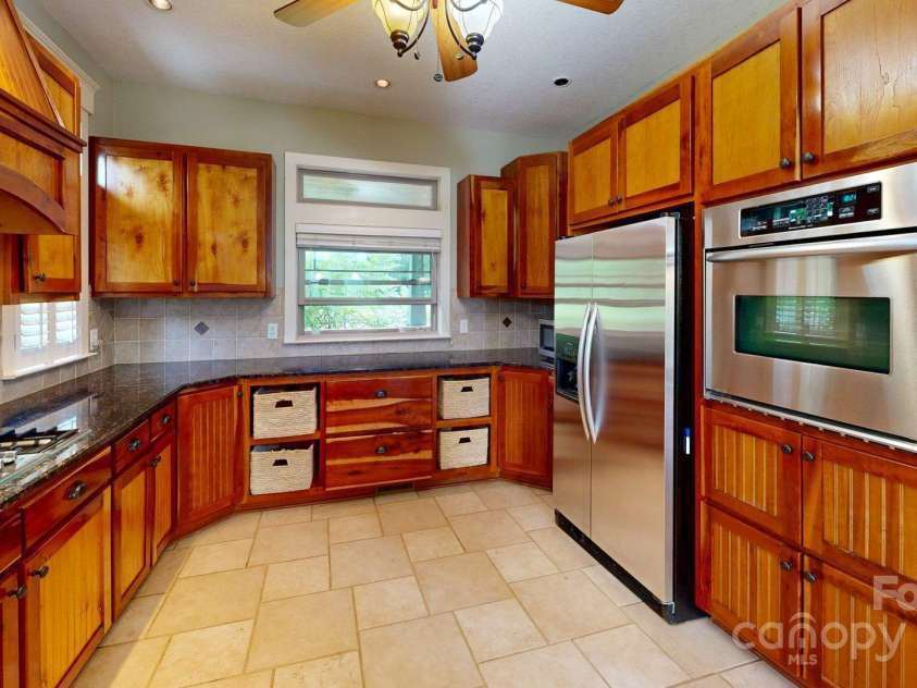 6 Sunrise Valley, Leicester, NC 28748.  MLS# CAR4283211, YatesRealty ID 2412. Cherry Cabinets in kitchen