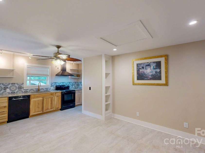 6 Sunrise Valley, Leicester, NC 28748.  MLS# CAR4283211, YatesRealty ID 2412. Guest House Living room and Kitchen Area