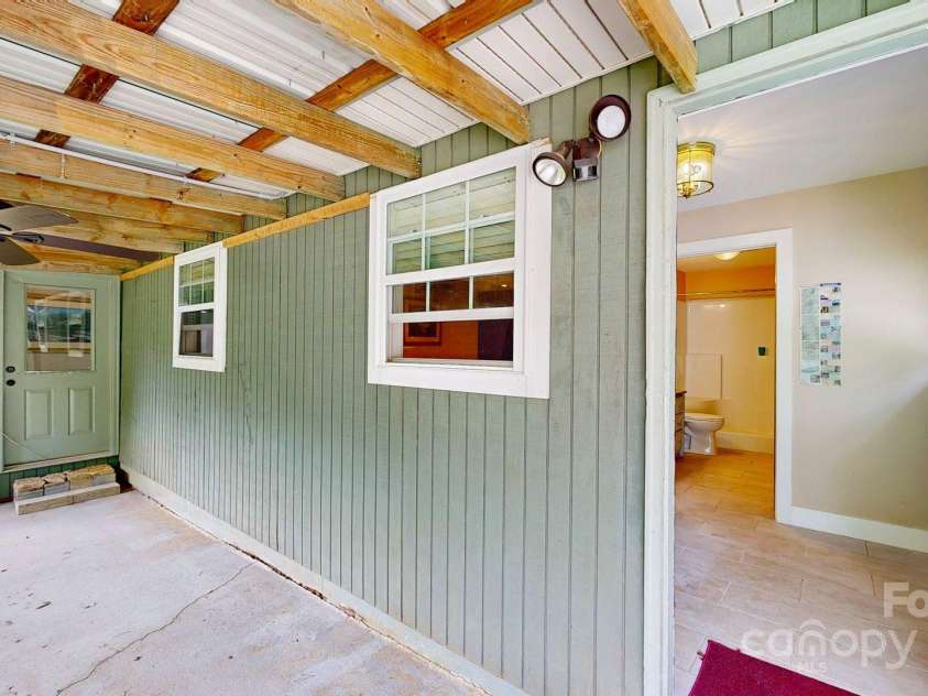 6 Sunrise Valley, Leicester, NC 28748.  MLS# CAR4283211, YatesRealty ID 2412. Guest House outdoor covered area