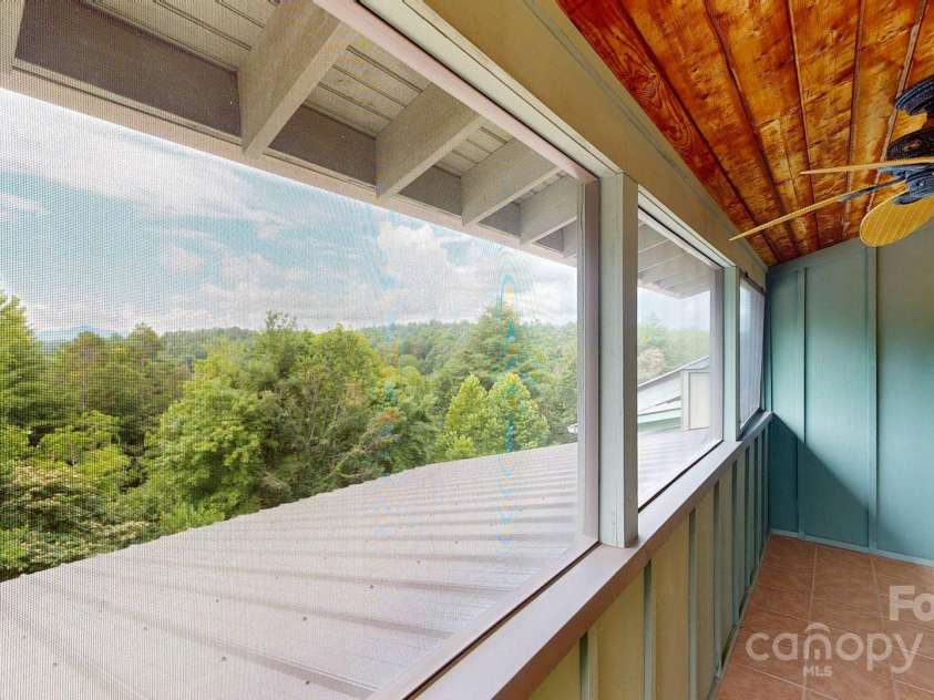 6 Sunrise Valley, Leicester, NC 28748.  MLS# CAR4283211, YatesRealty ID 2412. Screened Balcony off of upper bonus room