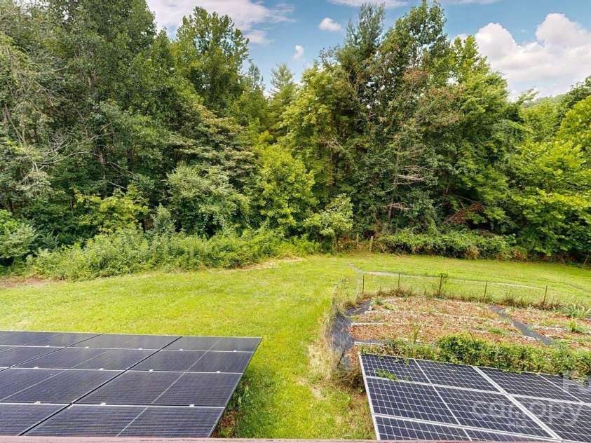 6 Sunrise Valley, Leicester, NC 28748.  MLS# CAR4283211, YatesRealty ID 2412. Solar Panels and Garden Area