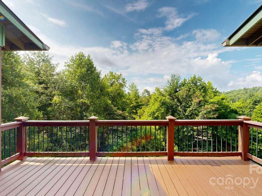 6 Sunrise Valley, Leicester, NC 28748.  MLS# CAR4283211, YatesRealty ID 2412. Views from deck looking out living room