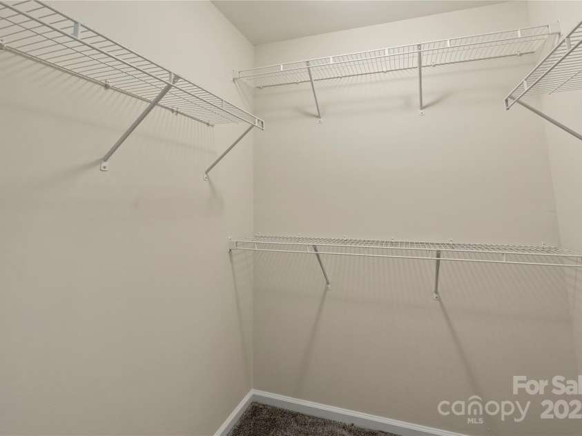 1556 Stanley Lucia Road, Mount Holly, NC 28120.  MLS# CAR4273688, YatesRealty ID 24123. 1 of 2 Primary walk in closets