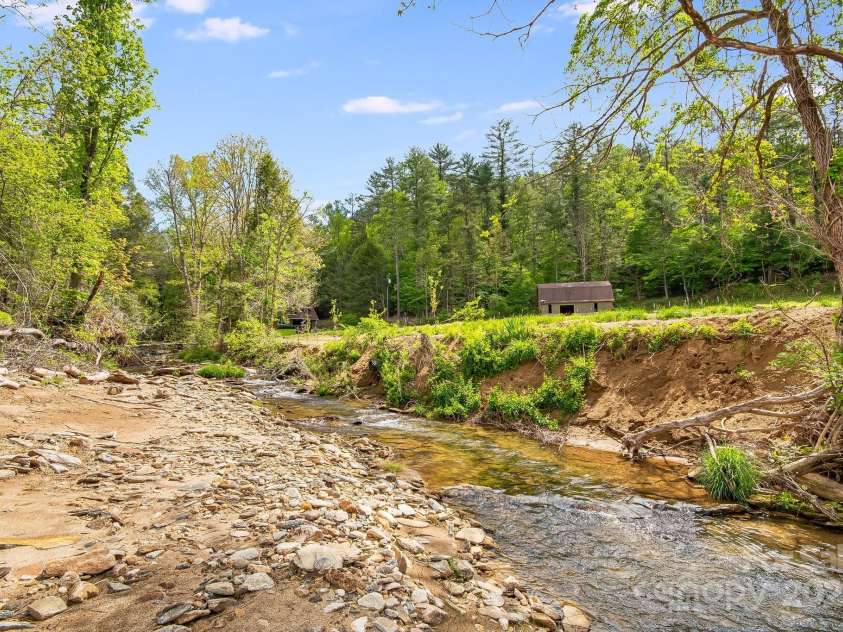 2191 Deep Gap Road, Flat Rock, NC 28731.  MLS# CAR4254612, YatesRealty ID 24129. Big Hungry River across the street.