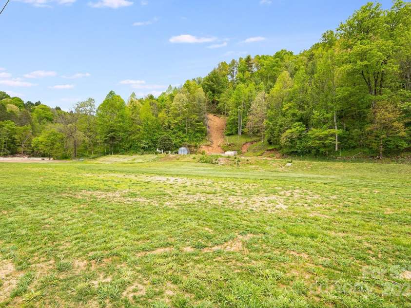 2191 Deep Gap Road, Flat Rock, NC 28731.  MLS# CAR4254612, YatesRealty ID 24129. Flat land for gardening, chickens or homesteading with no restrictions!