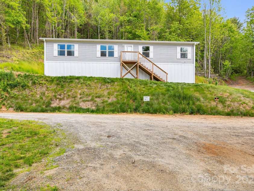 2191 Deep Gap Road, Flat Rock, NC 28731.  MLS# CAR4254612, YatesRealty ID 24129. Front of home, less than two years old!