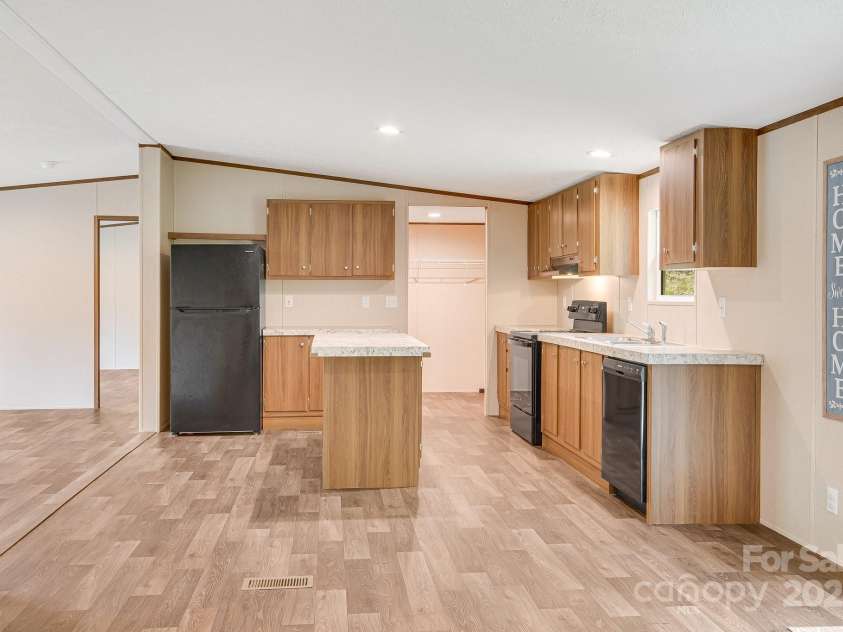 2191 Deep Gap Road, Flat Rock, NC 28731.  MLS# CAR4254612, YatesRealty ID 24129. Open kitchen with newer appliances