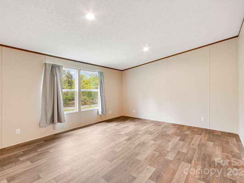 2191 Deep Gap Road, Flat Rock, NC 28731.  MLS# CAR4254612, YatesRealty ID 24129. Primary bedroom