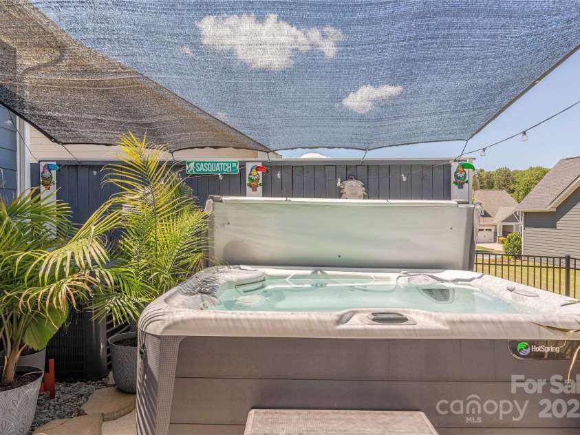 1022 Curling Creek Drive, Indian Trail, NC 28079.  MLS# CAR4255571, YatesRealty ID 24131. Relax in the hot tub