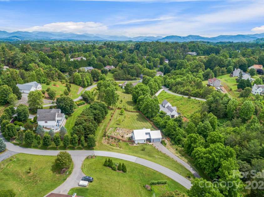 344 Hemlock Springs Trail, Weaverville, NC 28787.  MLS# CAR4271201, YatesRealty ID 24133. Aeriel view of this lovely home and sprawling property