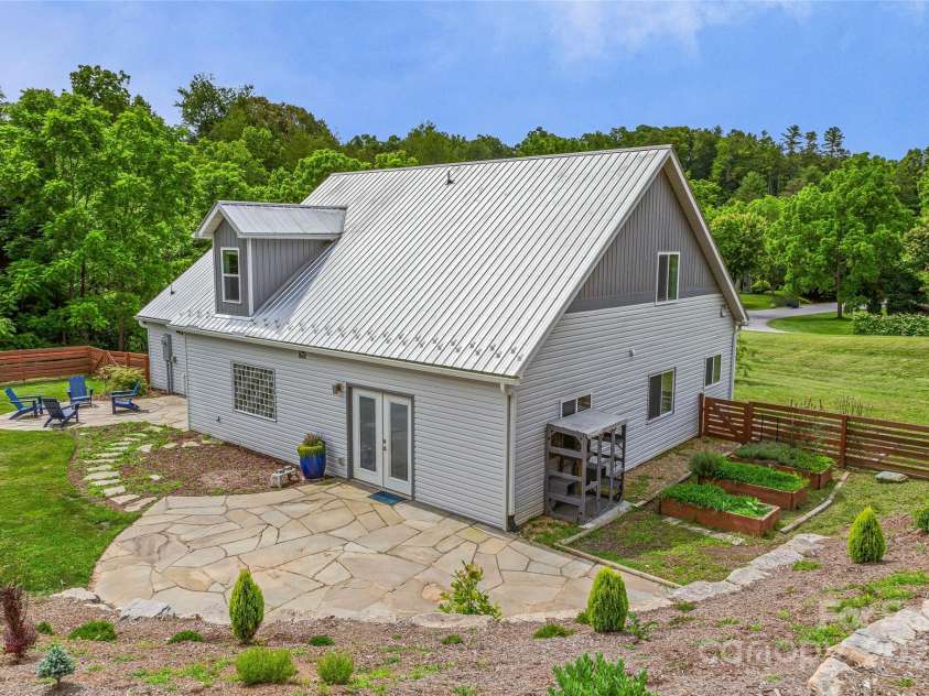 344 Hemlock Springs Trail, Weaverville, NC 28787.  MLS# CAR4271201, YatesRealty ID 24133. Raised garden beds - custom stone patios flow well for outdoor entertaining and family.