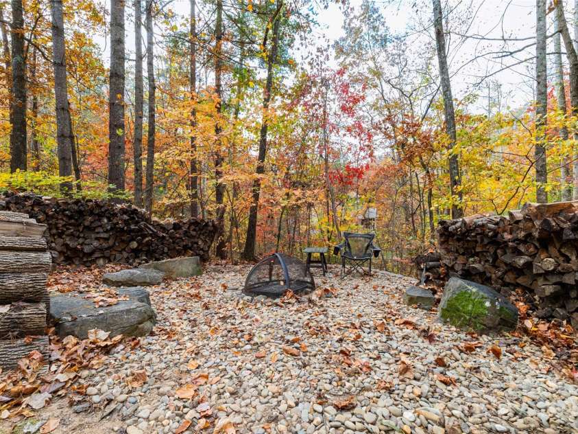 39 Hawks Pointe Lane, Weaverville, NC 28787.  MLS# CAR4228762, YatesRealty ID 24134. Fall colors around the fire pit