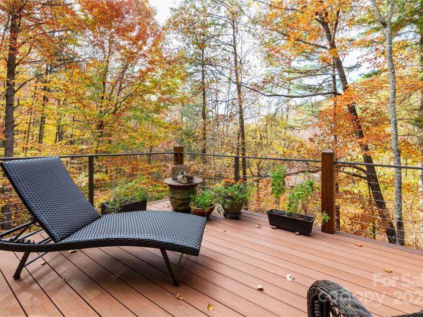39 Hawks Pointe Lane, Weaverville, NC 28787.  MLS# CAR4228762, YatesRealty ID 24134. Main floor deck in the fall