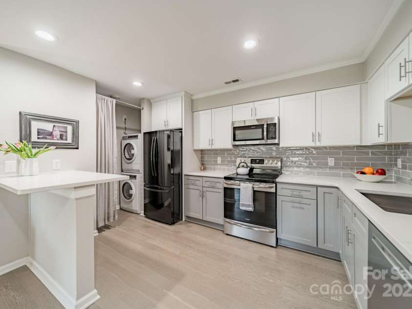 1001 Churchill Downs Court, Charlotte, NC 28211.  MLS# CAR4235260, YatesRealty ID 2414. Fully equipped kitchen including laundry units.