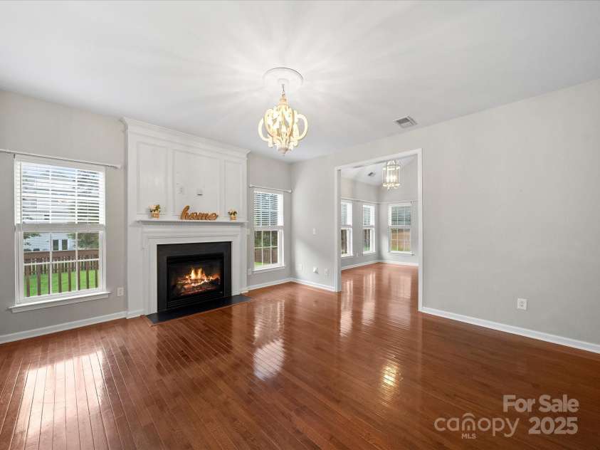 8004 Fountainbrook Drive, Indian Trail, NC 28079.  MLS# CAR4287908, YatesRealty ID 24146. Family room pours into sunroom