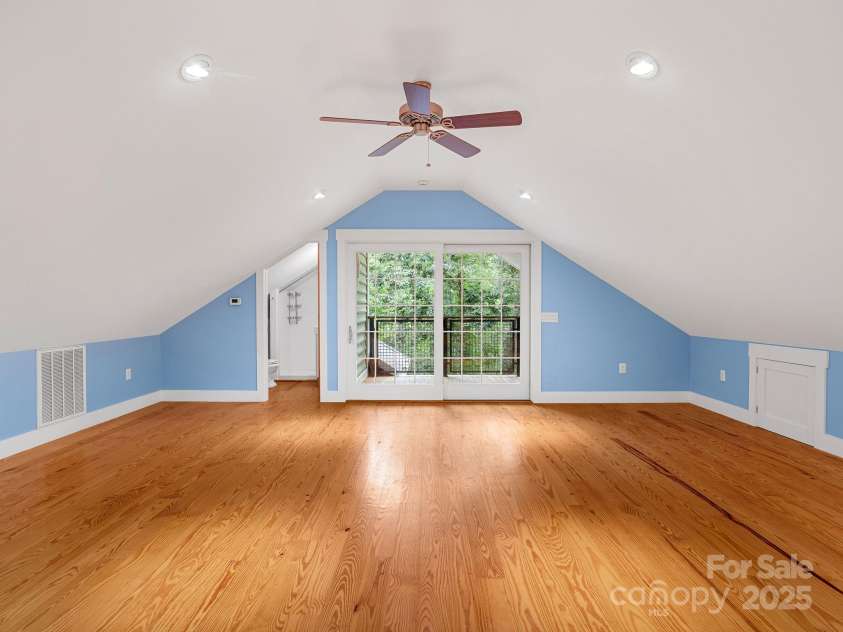 147 Woodland Road, Tryon, NC 28782.  MLS# CAR4277397, YatesRealty ID 24149. Full bath to the left and doors lead to the covered porch.