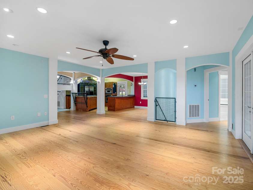 147 Woodland Road, Tryon, NC 28782.  MLS# CAR4277397, YatesRealty ID 24149. Great room looking toward kitchen and dining