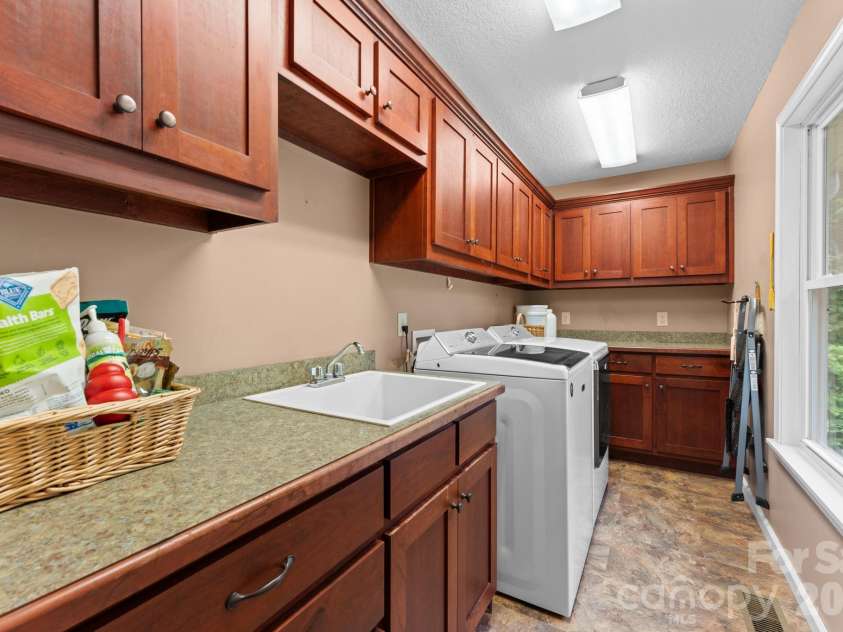 1268 Coon Creek Road, Franklin, NC 28734.  MLS# CAR4351679, YatesRealty ID 2415. Main Floor Laundry Room 