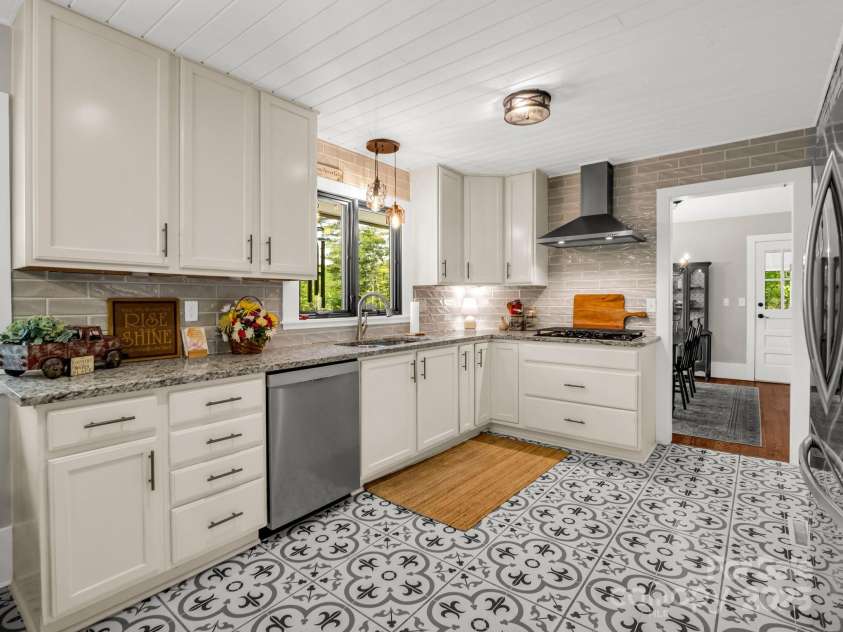 1351 Chanteloup Drive, Hendersonville, NC 28739.  MLS# CAR4250000, YatesRealty ID 24151. Kitchen looking into dining room