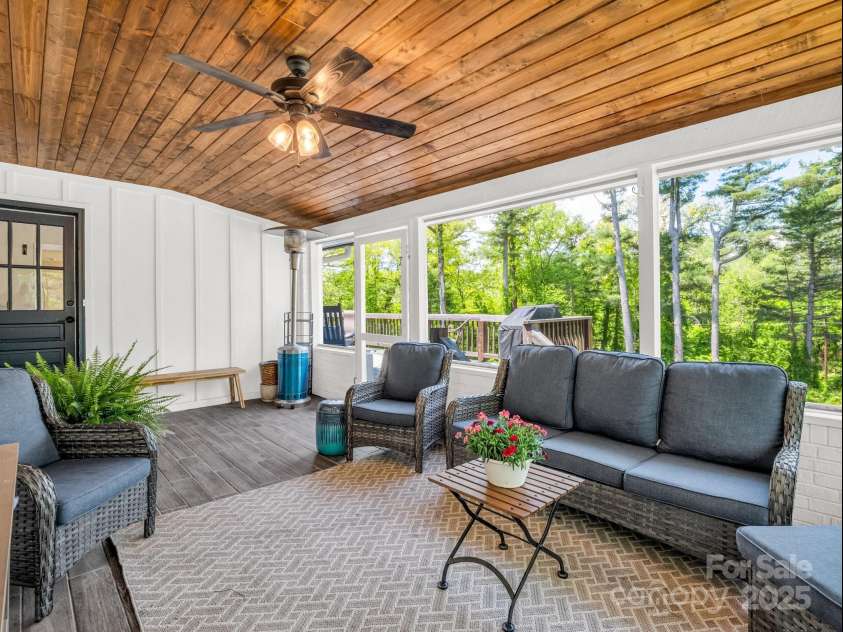 1351 Chanteloup Drive, Hendersonville, NC 28739.  MLS# CAR4250000, YatesRealty ID 24151. Plenty of room to relax and enjoy nature on the screened porch