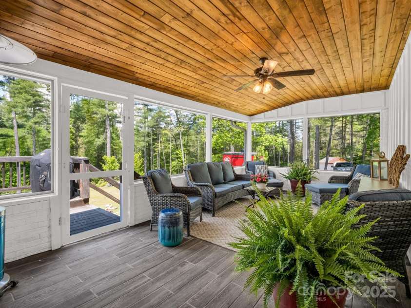 1351 Chanteloup Drive, Hendersonville, NC 28739.  MLS# CAR4250000, YatesRealty ID 24151. Screened porch off of dining room overlooking back yard