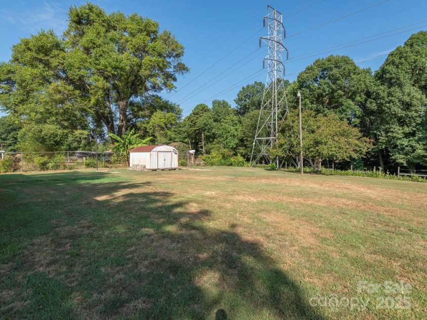 876 Stowe Lane, Gastonia, NC 28056.  MLS# CAR4260453, YatesRealty ID 24153. Backyard w/ storage shed