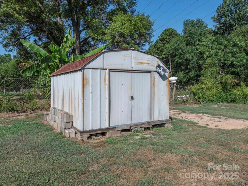 876 Stowe Lane, Gastonia, NC 28056.  MLS# CAR4260453, YatesRealty ID 24153. Storage shed