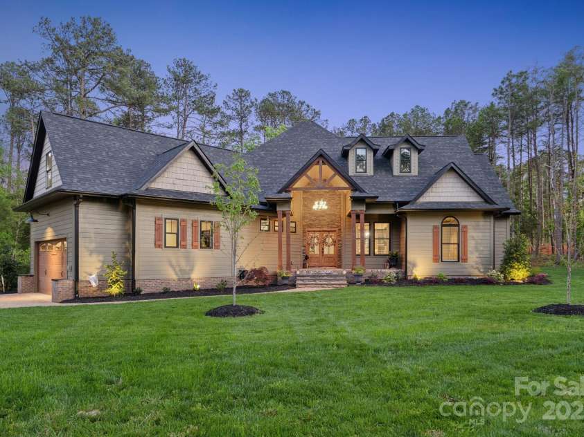 425 North Corner Road, Lancaster, SC 29720.  MLS# CAR4251122, YatesRealty ID 24155. Front of the home at twighlight