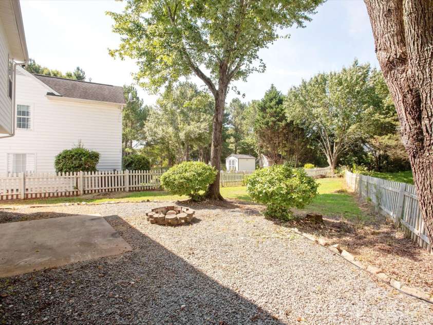 411 Carlisle Drive, Indian Trail, NC 28079.  MLS# CAR4271998, YatesRealty ID 24156. Backyard with Firepit