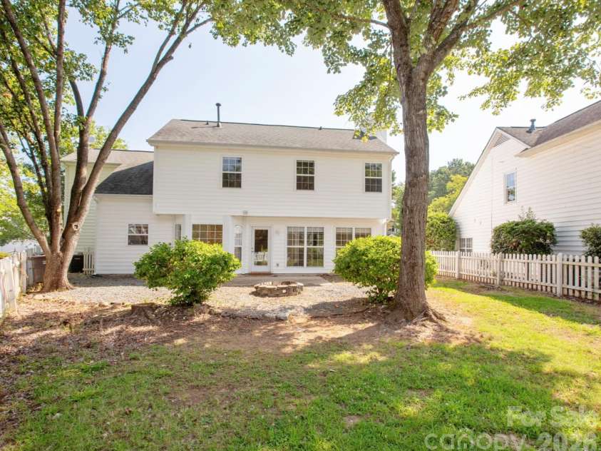 411 Carlisle Drive, Indian Trail, NC 28079.  MLS# CAR4271998, YatesRealty ID 24156. Backyard with Mature Trees