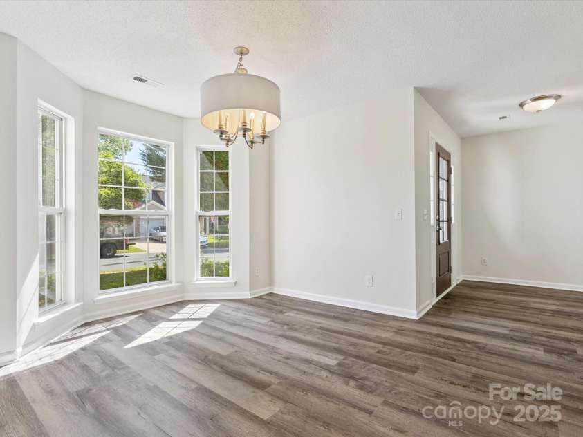 411 Carlisle Drive, Indian Trail, NC 28079.  MLS# CAR4271998, YatesRealty ID 24156. Breakfast area overlooking the back yard