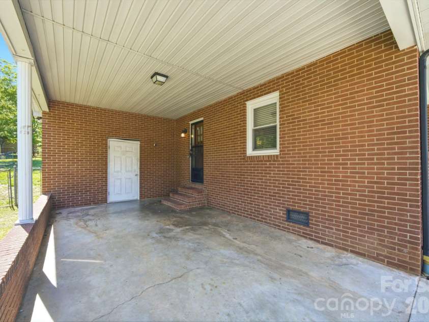 207 Starview Lane, Dallas, NC 28034.  MLS# CAR4381251, YatesRealty ID 24164. Carport / laundry