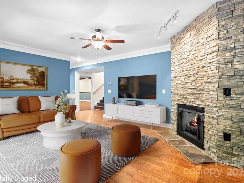 311 Carriage Crest Drive, Hendersonville, NC 28791.  MLS# CAR4263699, YatesRealty ID 24164. Digitally staged lower level entertainment space.