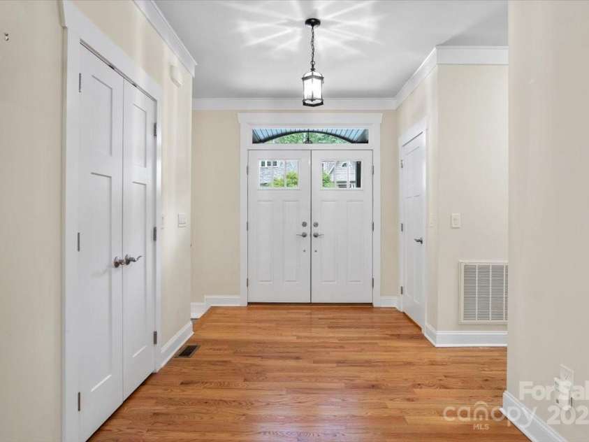 311 Carriage Crest Drive, Hendersonville, NC 28791.  MLS# CAR4263699, YatesRealty ID 24164. Foyer and front door.
