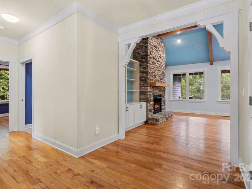 311 Carriage Crest Drive, Hendersonville, NC 28791.  MLS# CAR4263699, YatesRealty ID 24164. Foyer view looking towards two bedrooms and a bathroom on the main level (front of home).