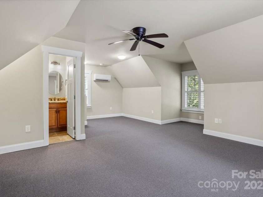 311 Carriage Crest Drive, Hendersonville, NC 28791.  MLS# CAR4263699, YatesRealty ID 24164. Large bonus room above the garage with a powder bathroom.