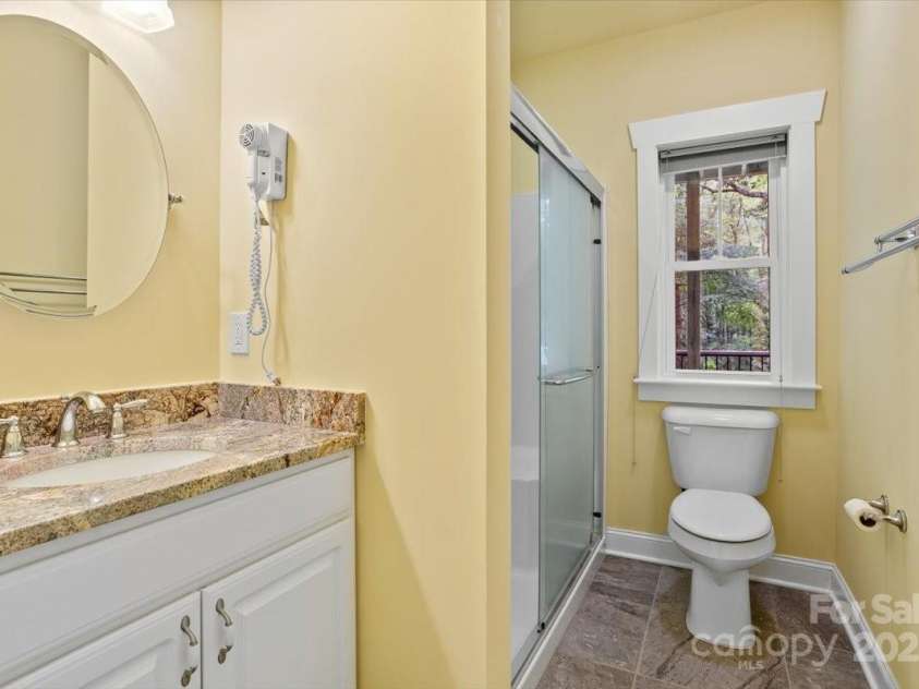 311 Carriage Crest Drive, Hendersonville, NC 28791.  MLS# CAR4263699, YatesRealty ID 24164. Lower level shared bathroom.