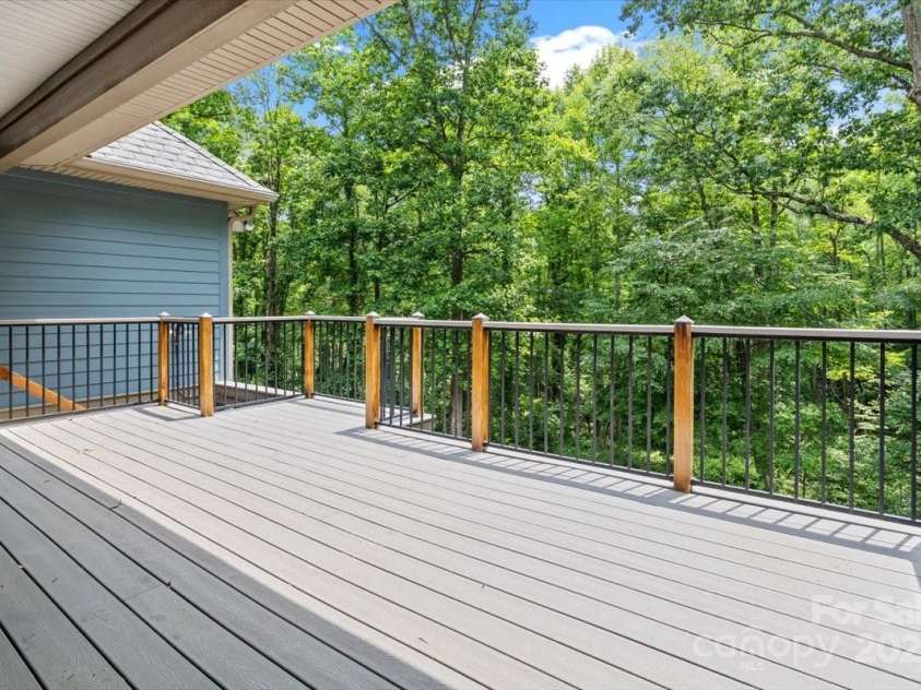 311 Carriage Crest Drive, Hendersonville, NC 28791.  MLS# CAR4263699, YatesRealty ID 24164. Main level deck.