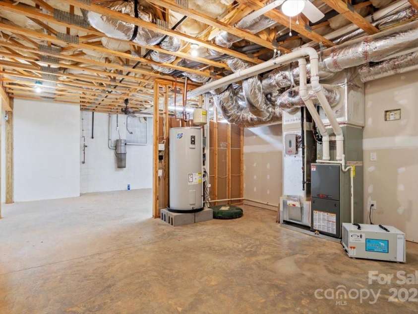311 Carriage Crest Drive, Hendersonville, NC 28791.  MLS# CAR4263699, YatesRealty ID 24164. Mechanical room, sump pump, whole house vacuum, HVAC, water heater, dehumidifier.