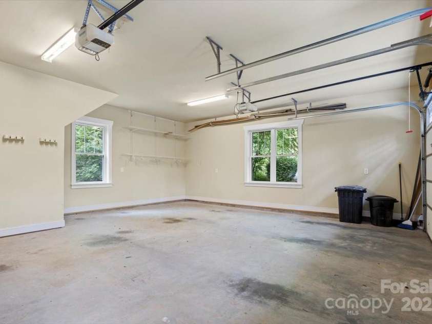 311 Carriage Crest Drive, Hendersonville, NC 28791.  MLS# CAR4263699, YatesRealty ID 24164. Oversized two-car garage, with individual single-car garage doors.