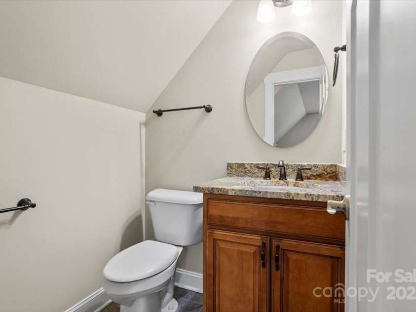 311 Carriage Crest Drive, Hendersonville, NC 28791.  MLS# CAR4263699, YatesRealty ID 24164. Powder bathroom above the garage.