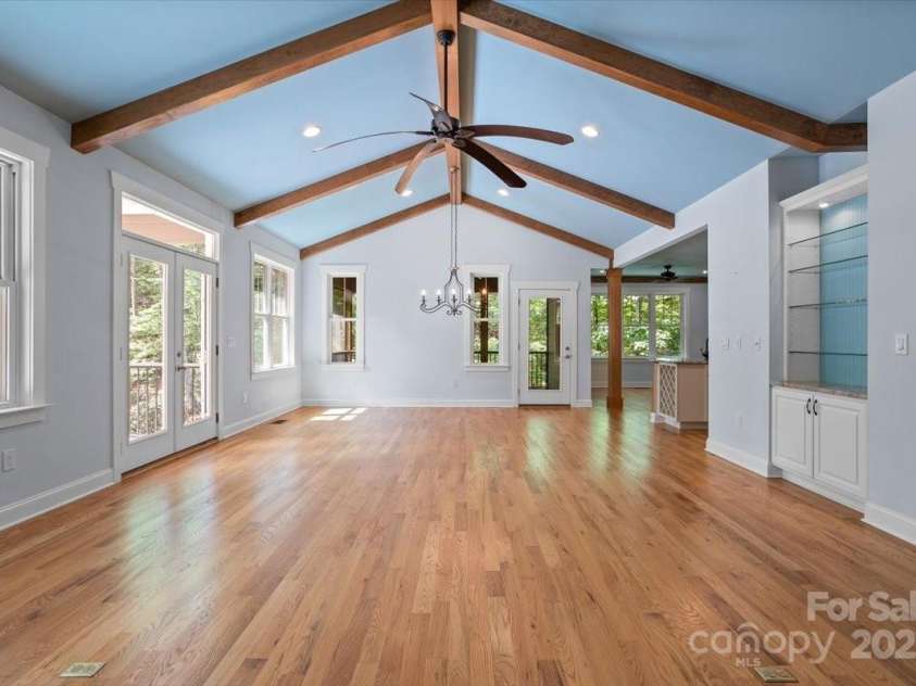 311 Carriage Crest Drive, Hendersonville, NC 28791.  MLS# CAR4263699, YatesRealty ID 24164. Standing at the main level fireplace, looking towards the dining room.