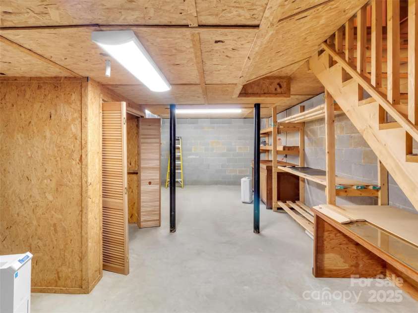 100 Tsali Drive, Waynesville, NC 28785.  MLS# CAR4244909, YatesRealty ID 24175. Basement area that can be finished