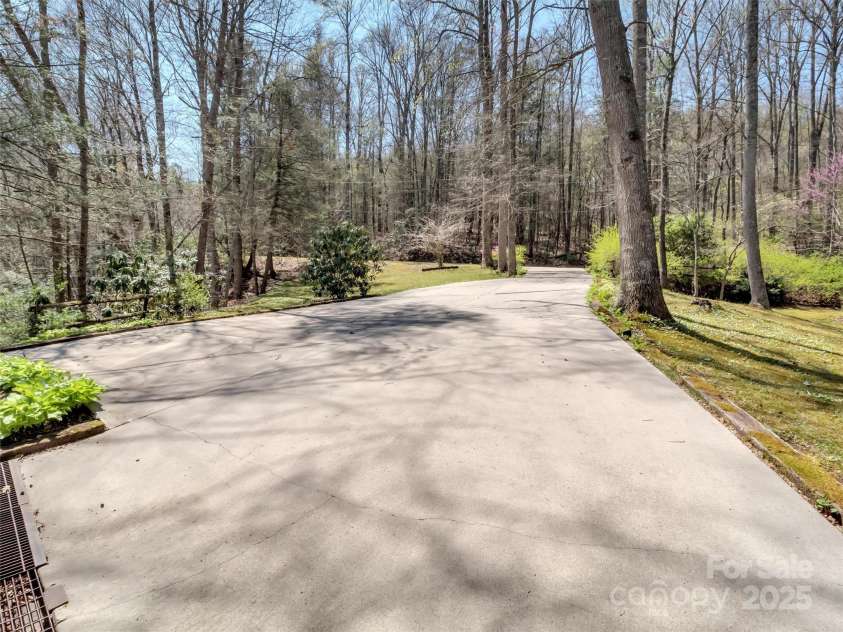 100 Tsali Drive, Waynesville, NC 28785.  MLS# CAR4244909, YatesRealty ID 24175. Concrete drive to carport