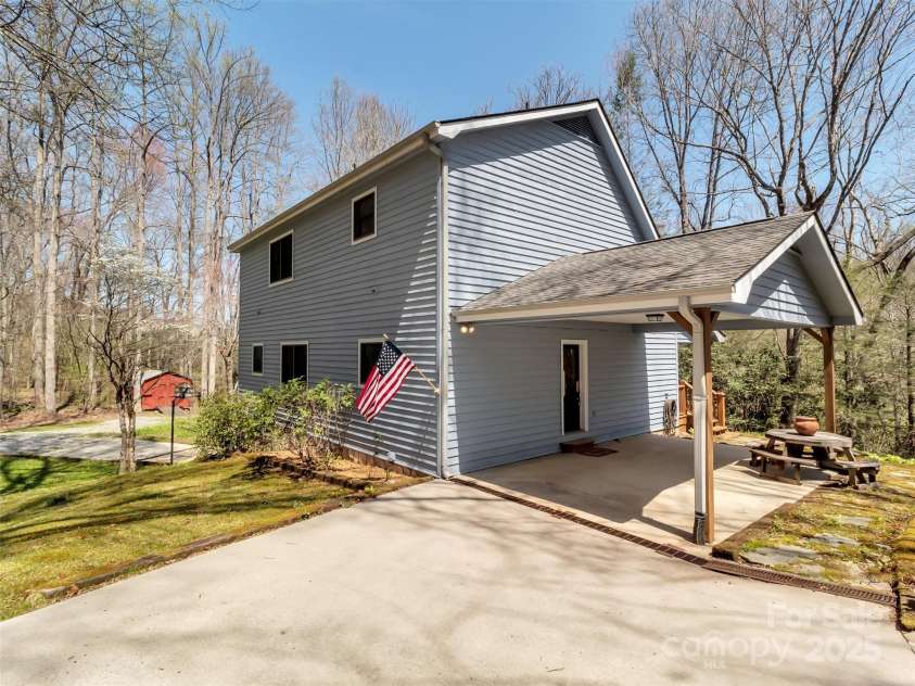 100 Tsali Drive, Waynesville, NC 28785.  MLS# CAR4244909, YatesRealty ID 24175. Drive to upper carport