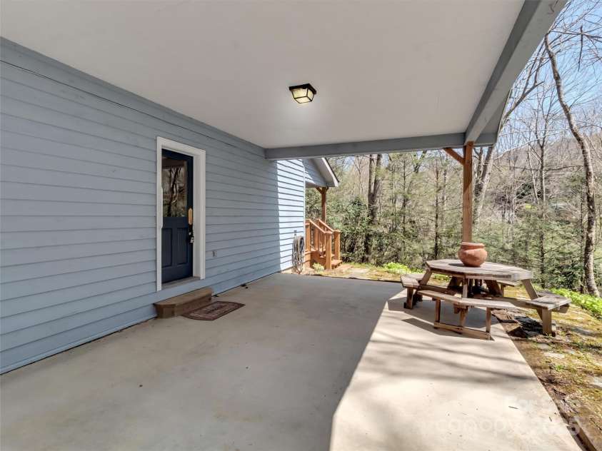 100 Tsali Drive, Waynesville, NC 28785.  MLS# CAR4244909, YatesRealty ID 24175. Upper carport