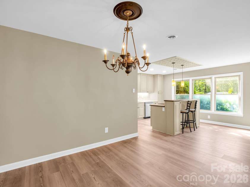 44 Jervey Road, Tryon, NC 28782.  MLS# CAR4381509, YatesRealty ID 24179. From the dining area toward the kitchen.